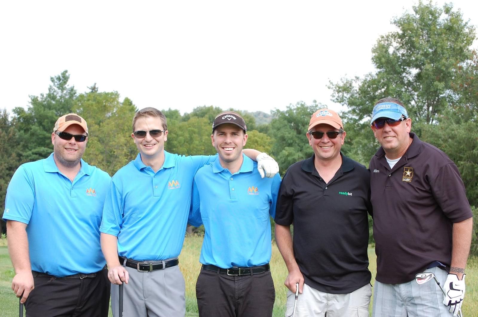 Caleb with AWA friends and supporters at the Golf Tournament in 2014